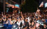 A Knicks Fan Balanced a TV on His Head in the Middle of a Crowd — and Then Came the Garbage Can